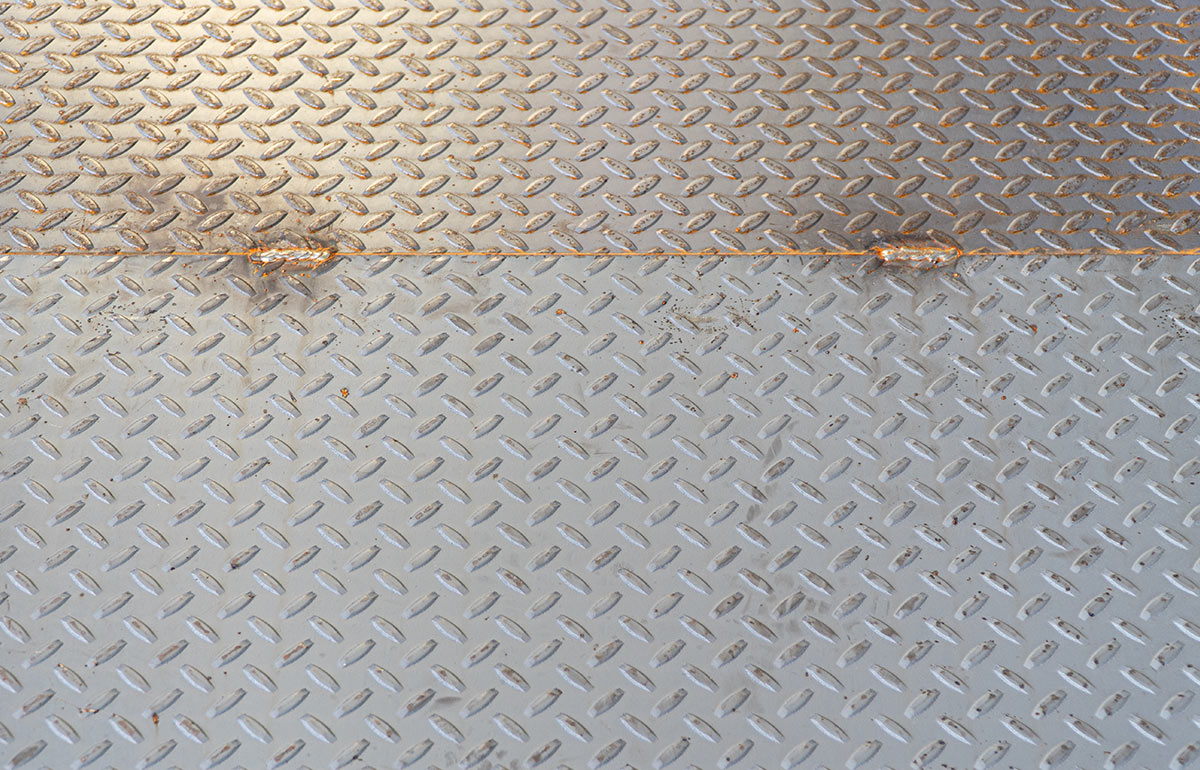 Diamond plate steel platform before powder coating